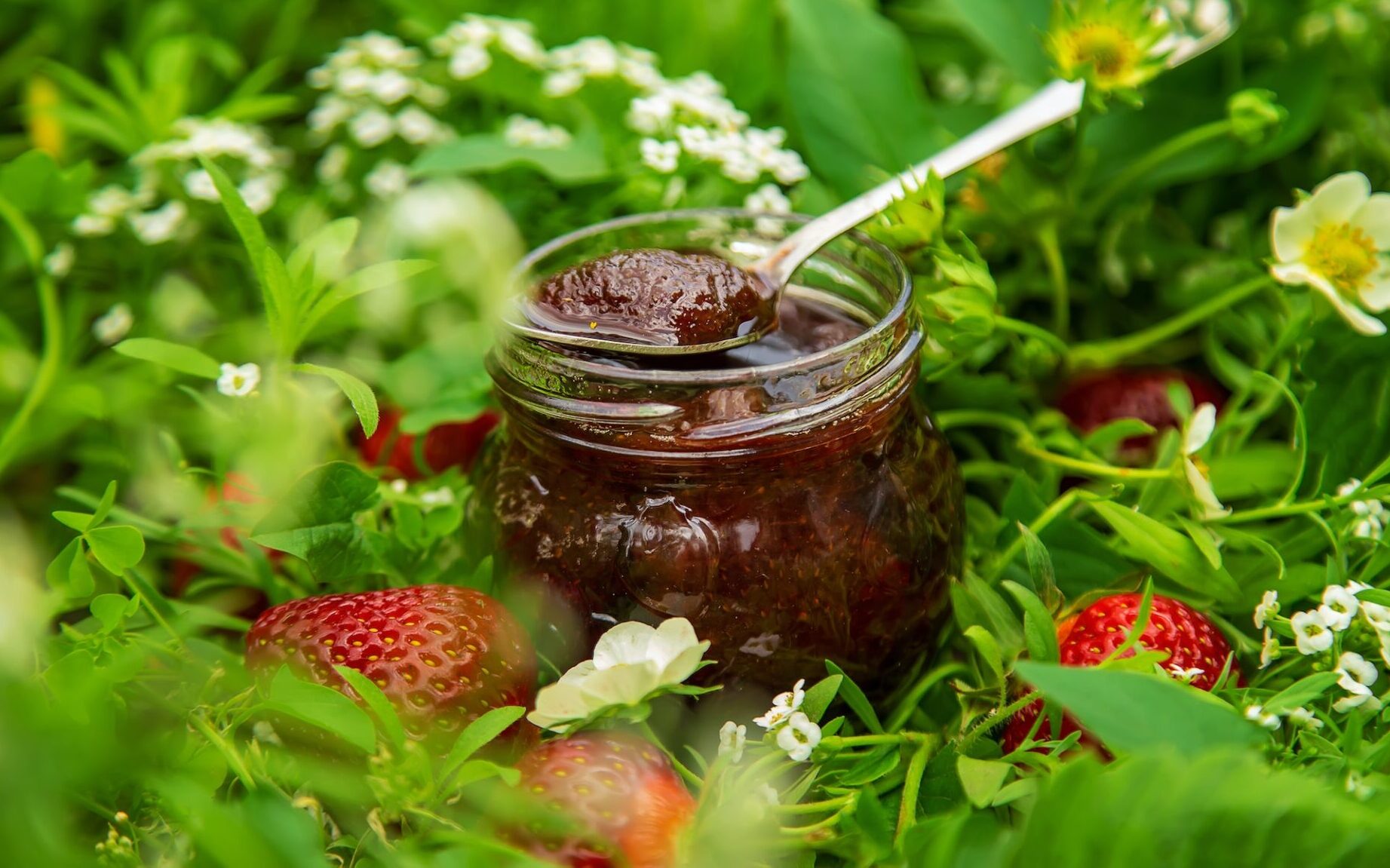 Homemade strawberry jam in a jar. Selective focus.